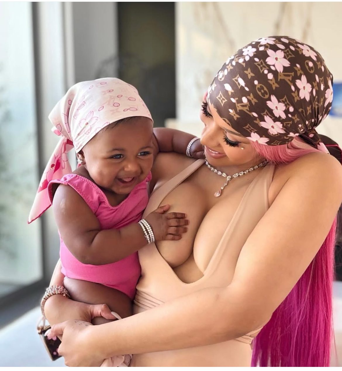Cardi B Debuts Daughter Blossom in a Pink and Tan Louis Vuitton X Takashi Murakami Cherry Blossom Accessories Cardi B Debuts Daughter Blossom in a Pink and Tan Louis Vuitton X Takashi Murakami Cherry Blossom Accessories