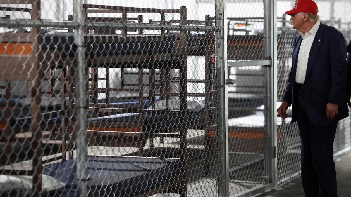 Trump tours Florida immigration lockup and jokes about escapees having to run from alligators