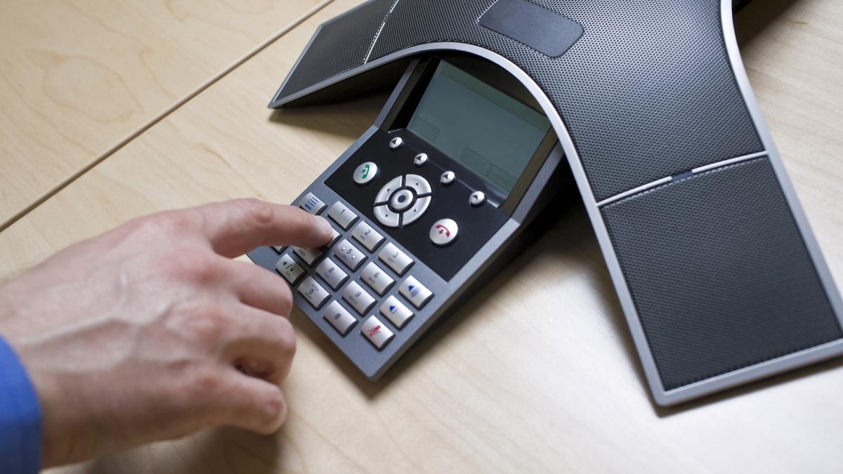 How does a telephone intercom function in an office setting?